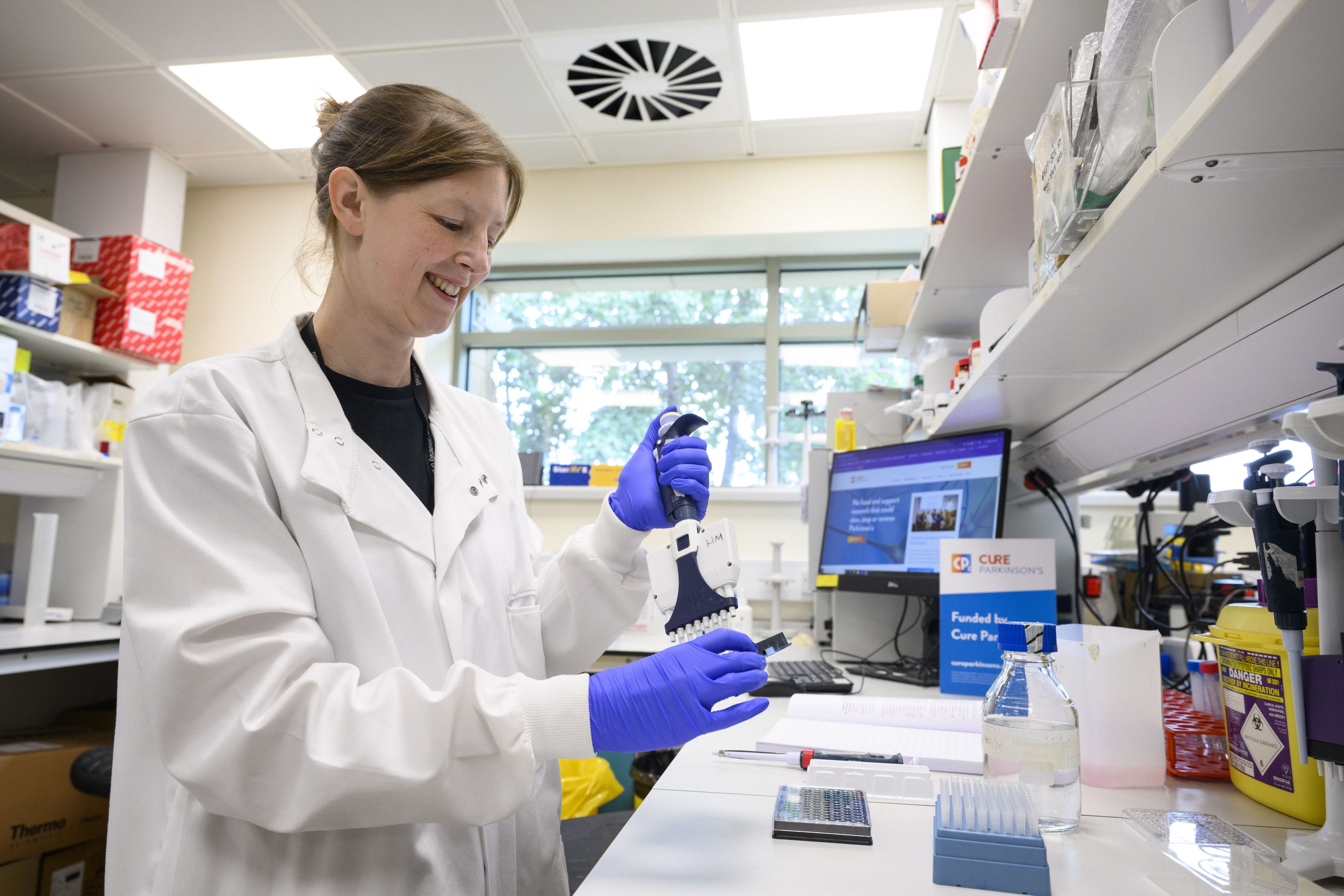A researcher in a lap using a scanning device.